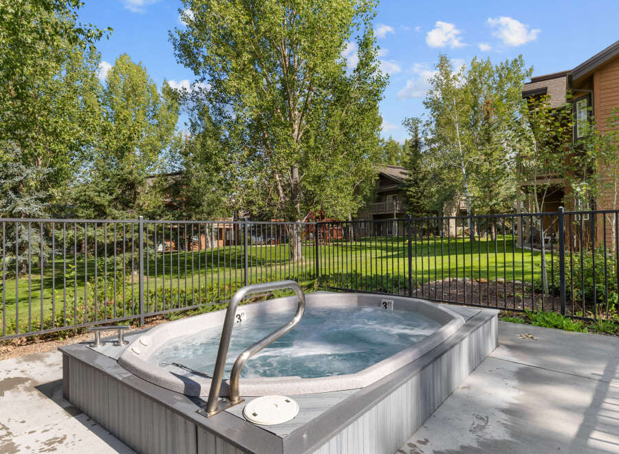 Relax and unwind in this luxurious hot tub, perfect for enjoying the beautiful outdoor scenery.
