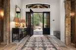 Step into luxury with this stunning entryway, showcasing a blend of rustic charm and modern elegance.