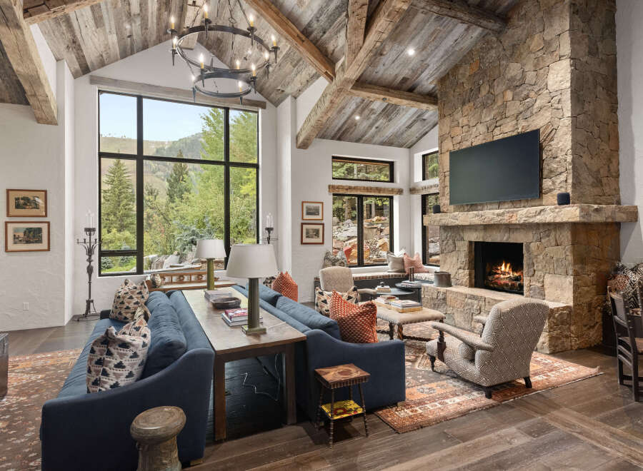 Experience luxury living in this stunning property featuring a cozy fireplace and a spacious living area.