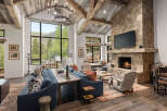 Experience luxury living in this stunning property featuring a cozy fireplace and a spacious living area.