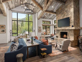 Experience luxury living in this stunning property featuring a cozy fireplace and a spacious living area.