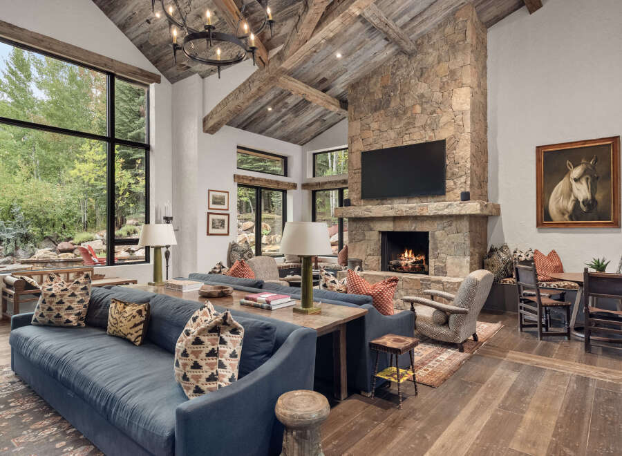 Experience luxury living in this stunning property featuring a cozy fireplace and a spacious living area.