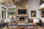 Experience the epitome of luxury living in this stunning property, featuring a grand stone fireplace as the focal point.