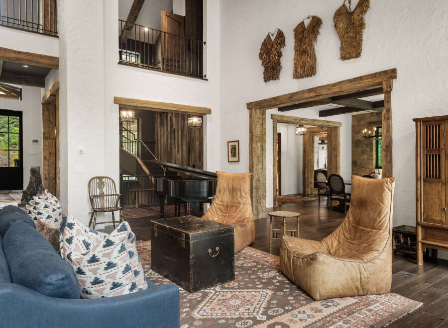 This stunning property boasts a rustic yet elegant interior design, perfect for those seeking a luxurious living experience.