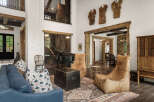 This stunning property boasts a rustic yet elegant interior design, perfect for those seeking a luxurious living experience.