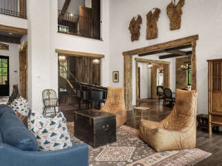 This stunning property boasts a rustic yet elegant interior design, perfect for those seeking a luxurious living experience.