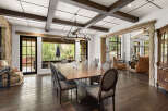 This stunning dining room showcases a perfect blend of rustic charm and modern elegance.