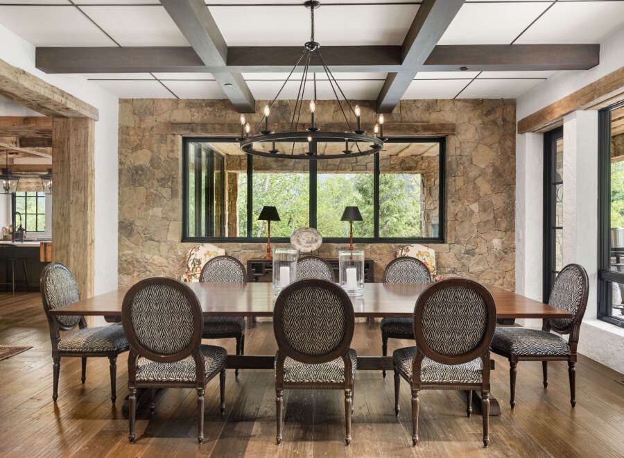 This stunning dining room showcases a blend of rustic charm and modern elegance.