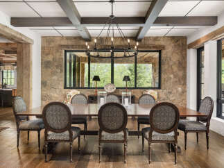This stunning dining room showcases a blend of rustic charm and modern elegance.
