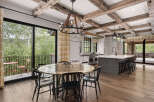 This stunning kitchen and dining area boasts a rustic yet modern design, perfect for entertaining.