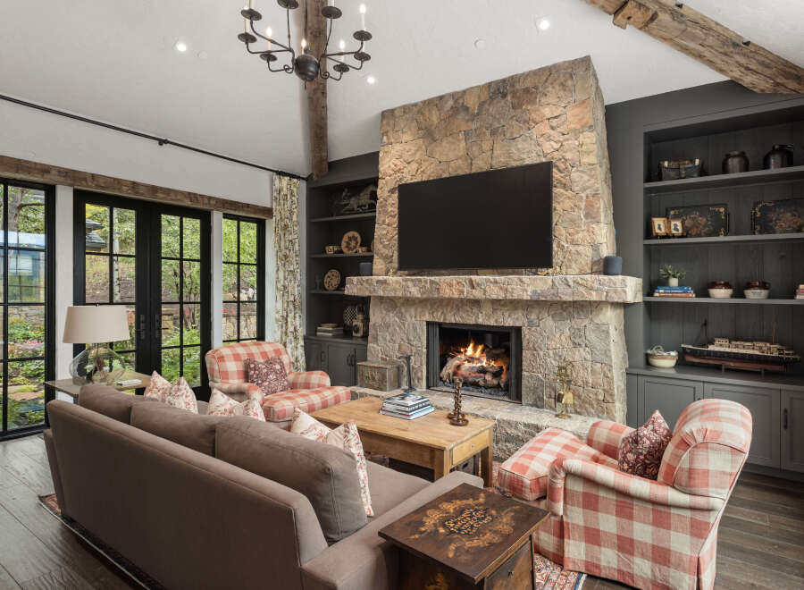 This stunning living room boasts a cozy fireplace, perfect for chilly evenings.