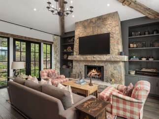 This stunning living room boasts a cozy fireplace, perfect for chilly evenings.