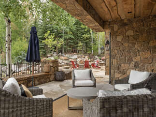Experience luxury living in this stunning outdoor space, perfect for relaxation and entertaining.