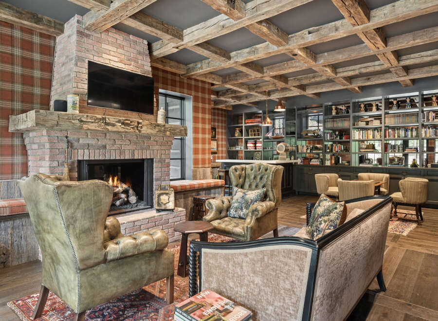 This stunning living space features a cozy brick fireplace, perfect for relaxing evenings.