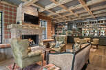 This stunning living space features a cozy brick fireplace, perfect for relaxing evenings.