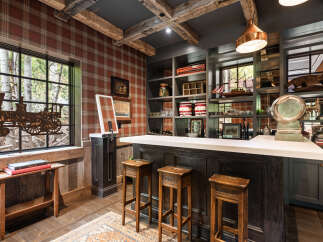 Step into luxury with this stunning bar area, perfect for entertaining guests or enjoying a quiet evening.
