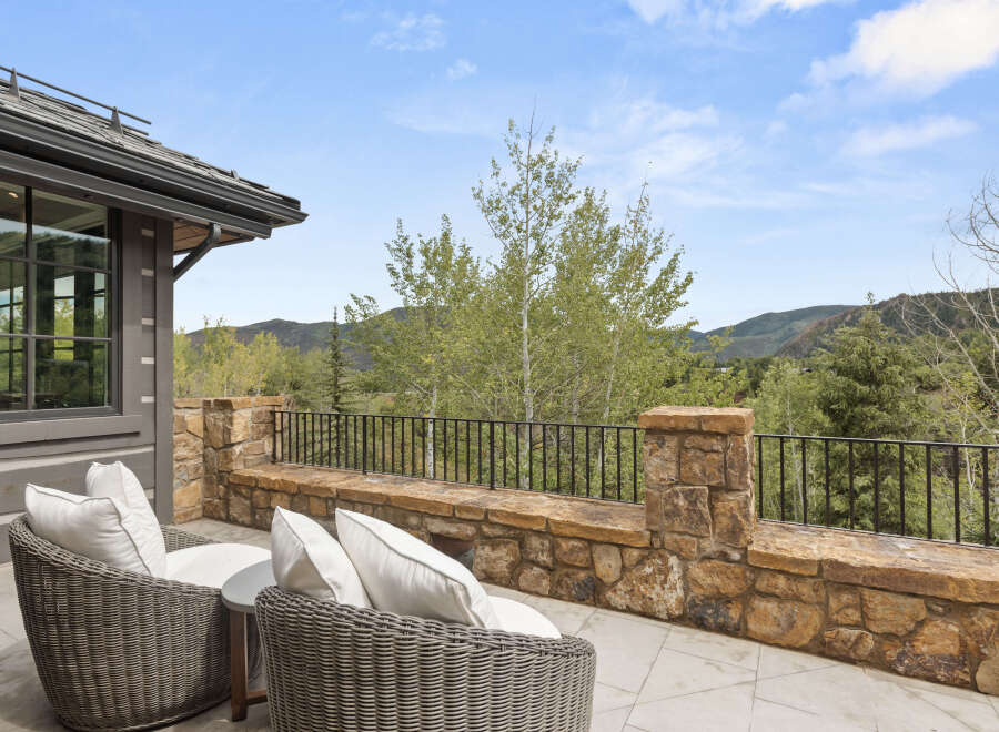 Enjoy breathtaking mountain views from this luxurious outdoor patio.