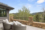 Enjoy breathtaking mountain views from this luxurious outdoor patio.