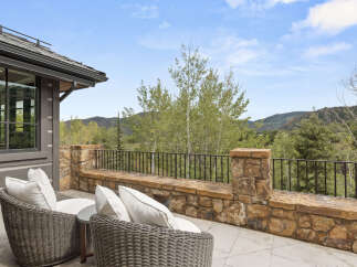 Enjoy breathtaking mountain views from this luxurious outdoor patio.