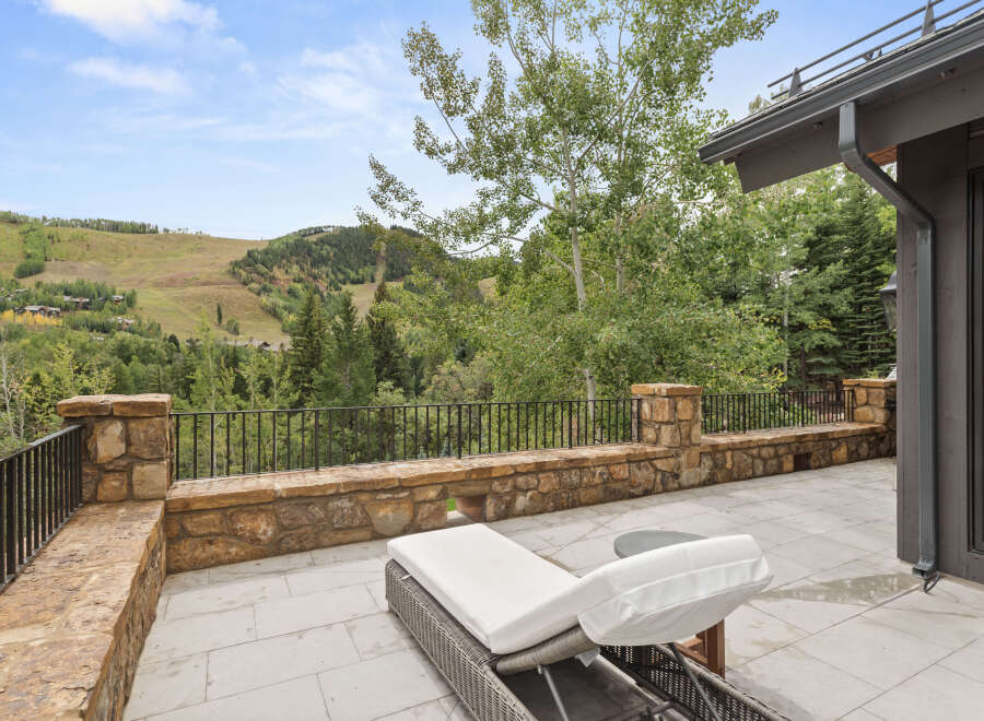 Enjoy breathtaking mountain views from this luxurious outdoor patio.