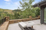 Enjoy breathtaking mountain views from this luxurious outdoor patio.