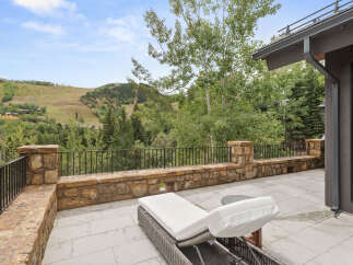 Enjoy breathtaking mountain views from this luxurious outdoor patio.