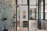 Step into luxury with this stunning bathroom, showcasing a modern design with dark tile accents.