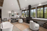 This luxurious bathroom boasts a modern design with rustic elements.