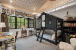 This charming bedroom features a unique bunk bed designed to resemble a house, perfect for a child's imaginative play.