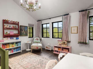Step into a whimsical children's room, perfect for imaginative play and cozy relaxation.
