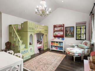 Step into a whimsical children's room, featuring a custom-built, castle-themed bunk bed that sparks imagination.