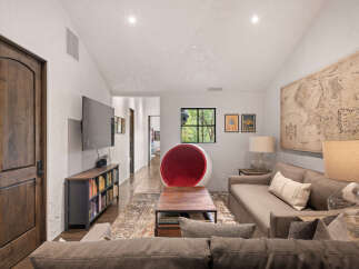 Step into luxury with this stunning living space, featuring a modern design and high-end finishes.