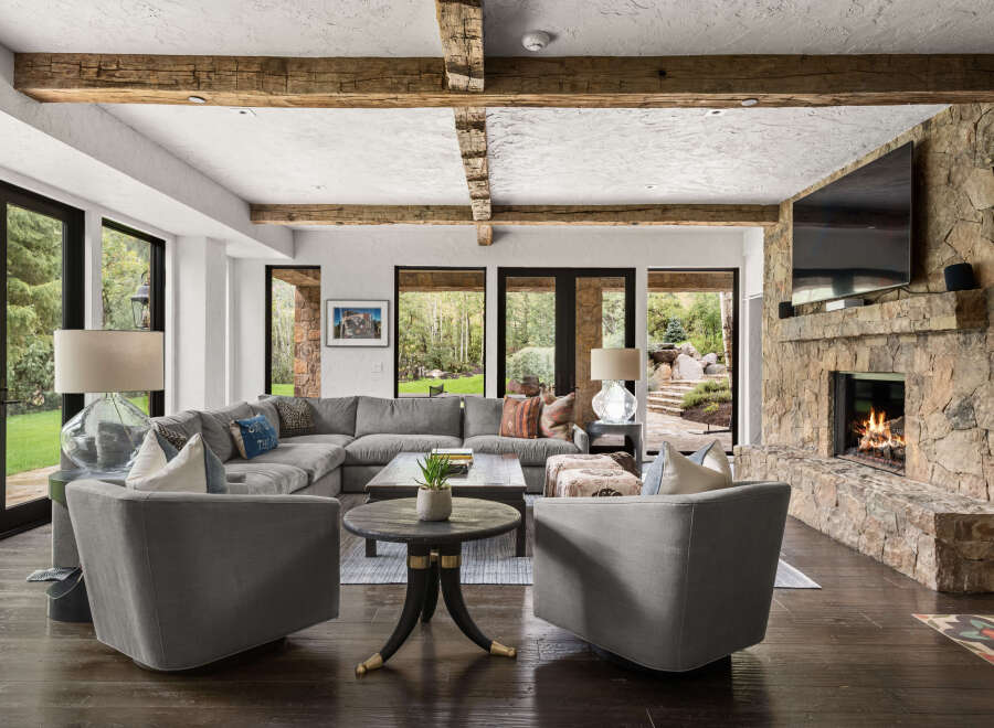 This stunning living room boasts a cozy fireplace, perfect for chilly evenings.