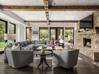 This stunning living room boasts a cozy fireplace, perfect for chilly evenings.
