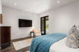 This stunning bedroom boasts a modern design with a touch of elegance.