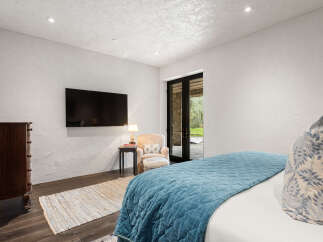 This stunning bedroom boasts a modern design with a touch of elegance.