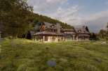This stunning property boasts a rustic, yet modern design, perfect for those seeking a luxurious retreat.