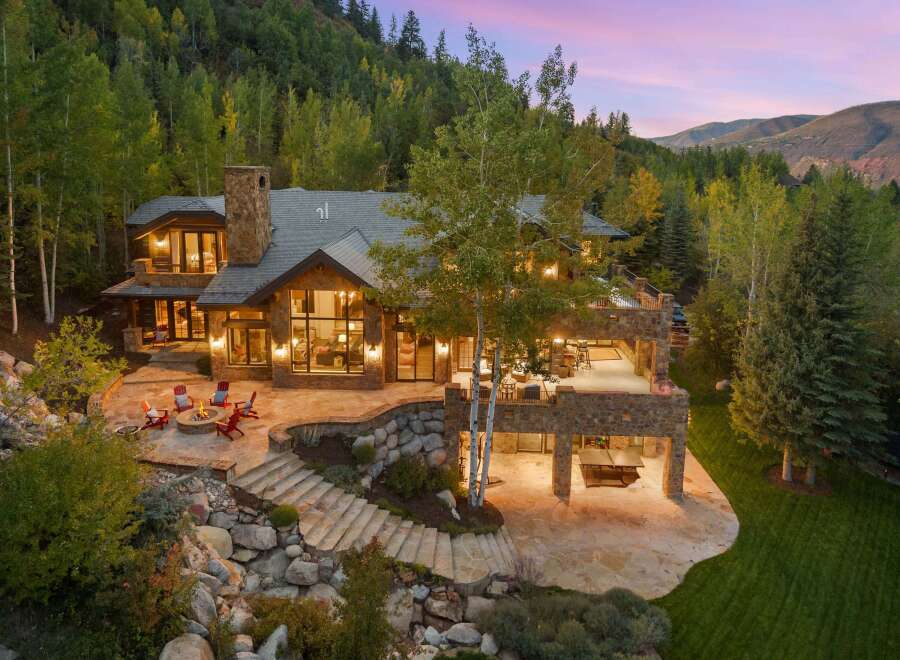 This stunning mountain estate boasts luxurious living with breathtaking views.