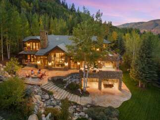 This stunning mountain estate boasts luxurious living with breathtaking views.