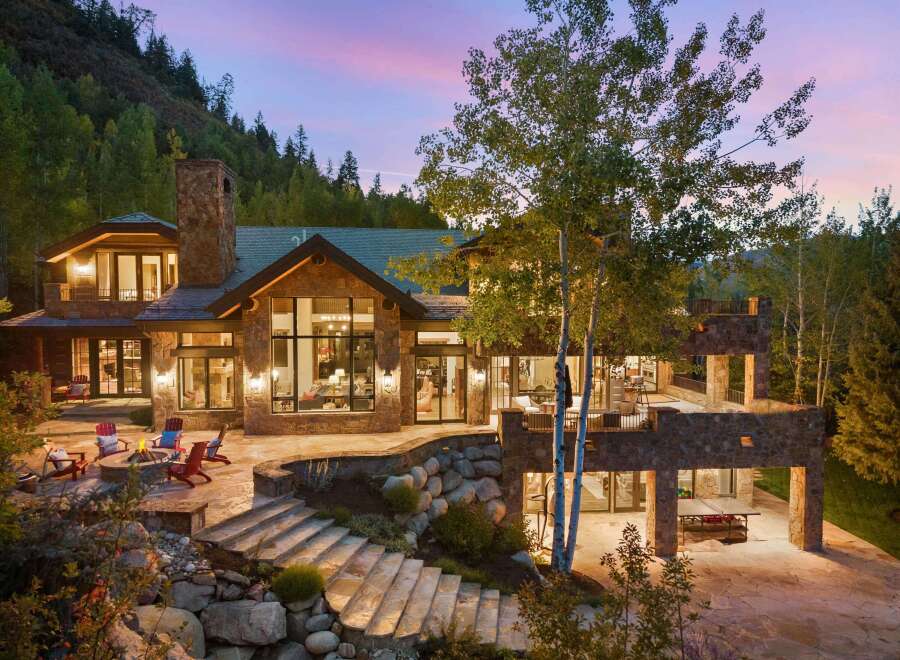 This stunning mountain home boasts exquisite architecture and design, perfect for luxurious living.