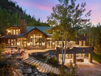 This stunning mountain home boasts exquisite architecture and design, perfect for luxurious living.