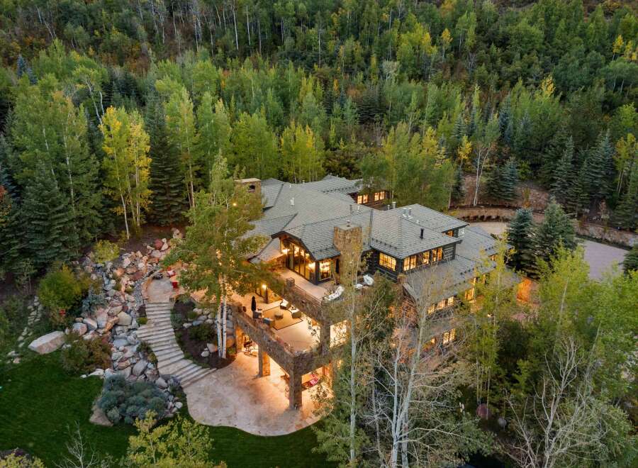 This stunning property offers a luxurious retreat surrounded by lush greenery and breathtaking views.