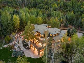 This stunning property offers a luxurious retreat surrounded by lush greenery and breathtaking views.