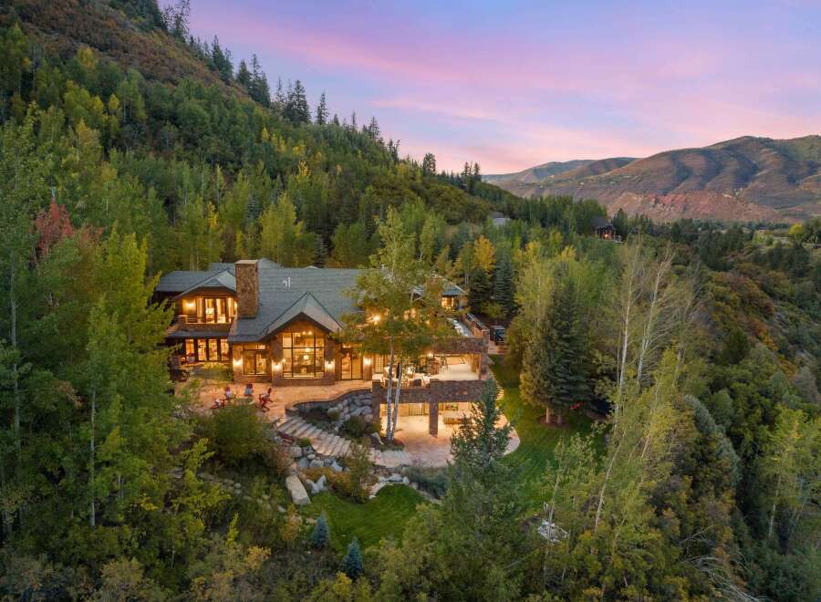 Nestled in a serene, wooded landscape, this stunning property offers unparalleled privacy and breathtaking views.