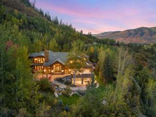 Nestled in a serene, wooded landscape, this stunning property offers unparalleled privacy and breathtaking views.