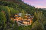 Nestled amidst a lush, tree-filled landscape, this stunning property offers a luxurious retreat.