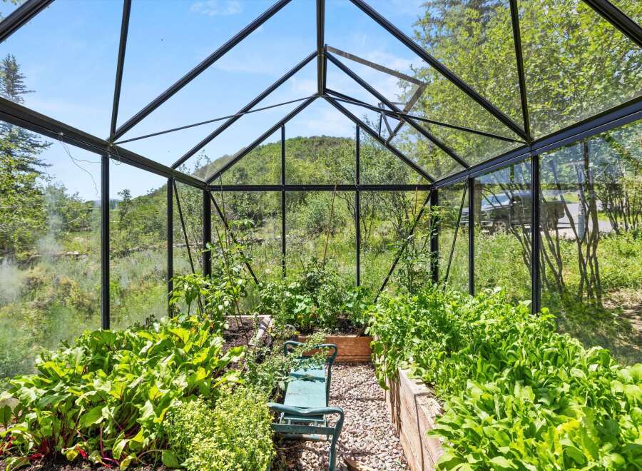 This stunning property boasts a beautiful greenhouse, perfect for cultivating your own fresh produce.