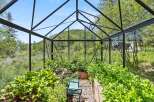 This stunning property boasts a beautiful greenhouse, perfect for cultivating your own fresh produce.