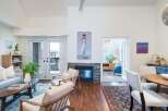 Step into luxury with this stunning property, featuring a cozy fireplace and elegant hardwood floors.