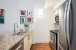 This stunning kitchen boasts a modern design with granite countertops and stainless steel appliances.
